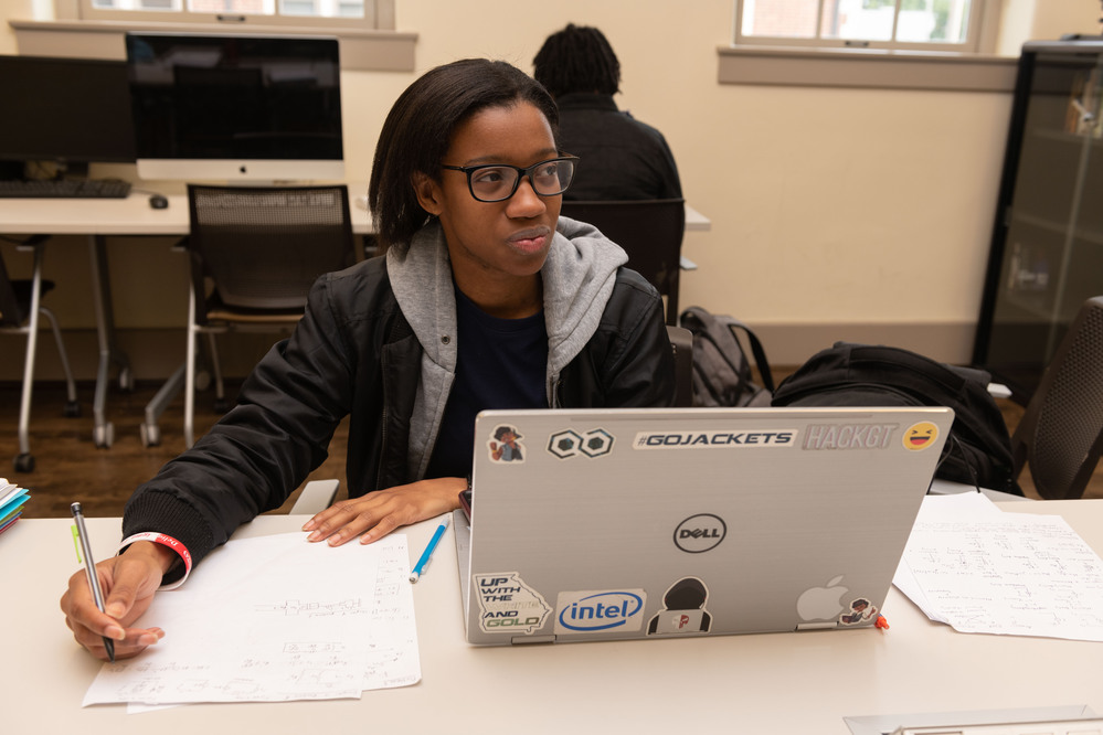 Tech student working on her laptop